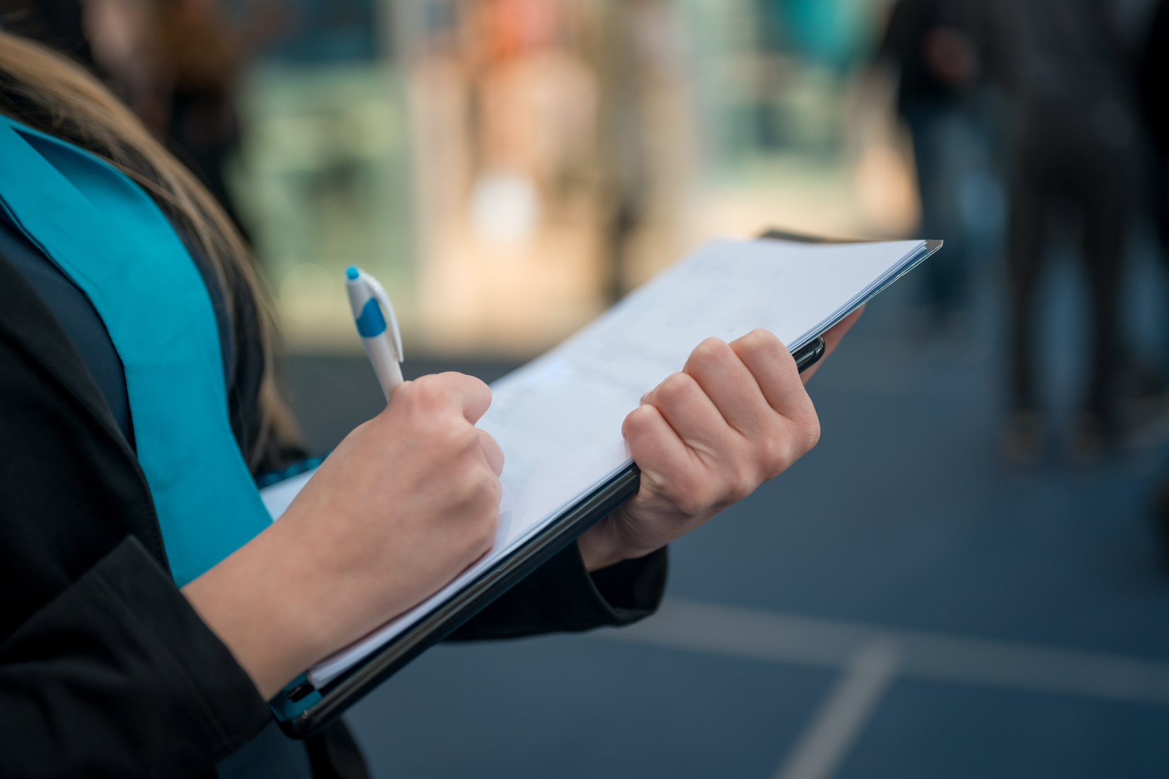 Woman holding clipboard checklist